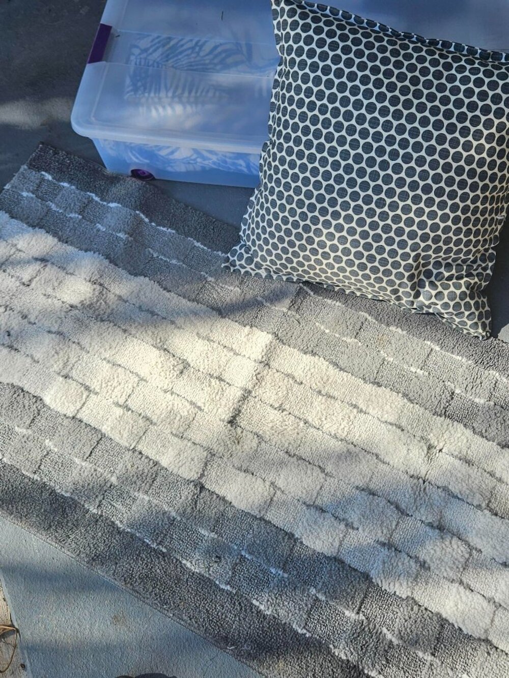 grey rug and pillow